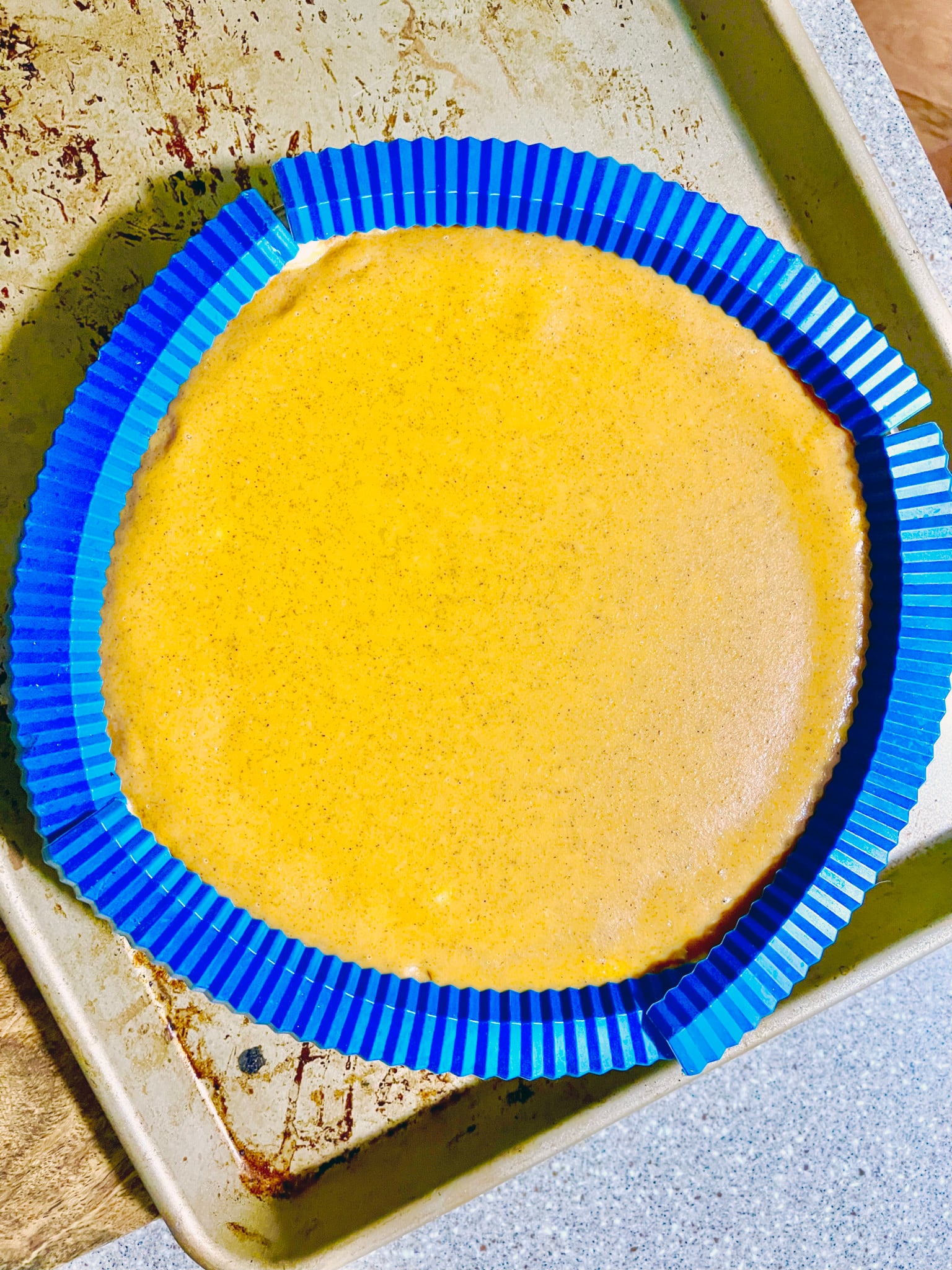 Ready to bake pie with silicone crust covers around the rim.