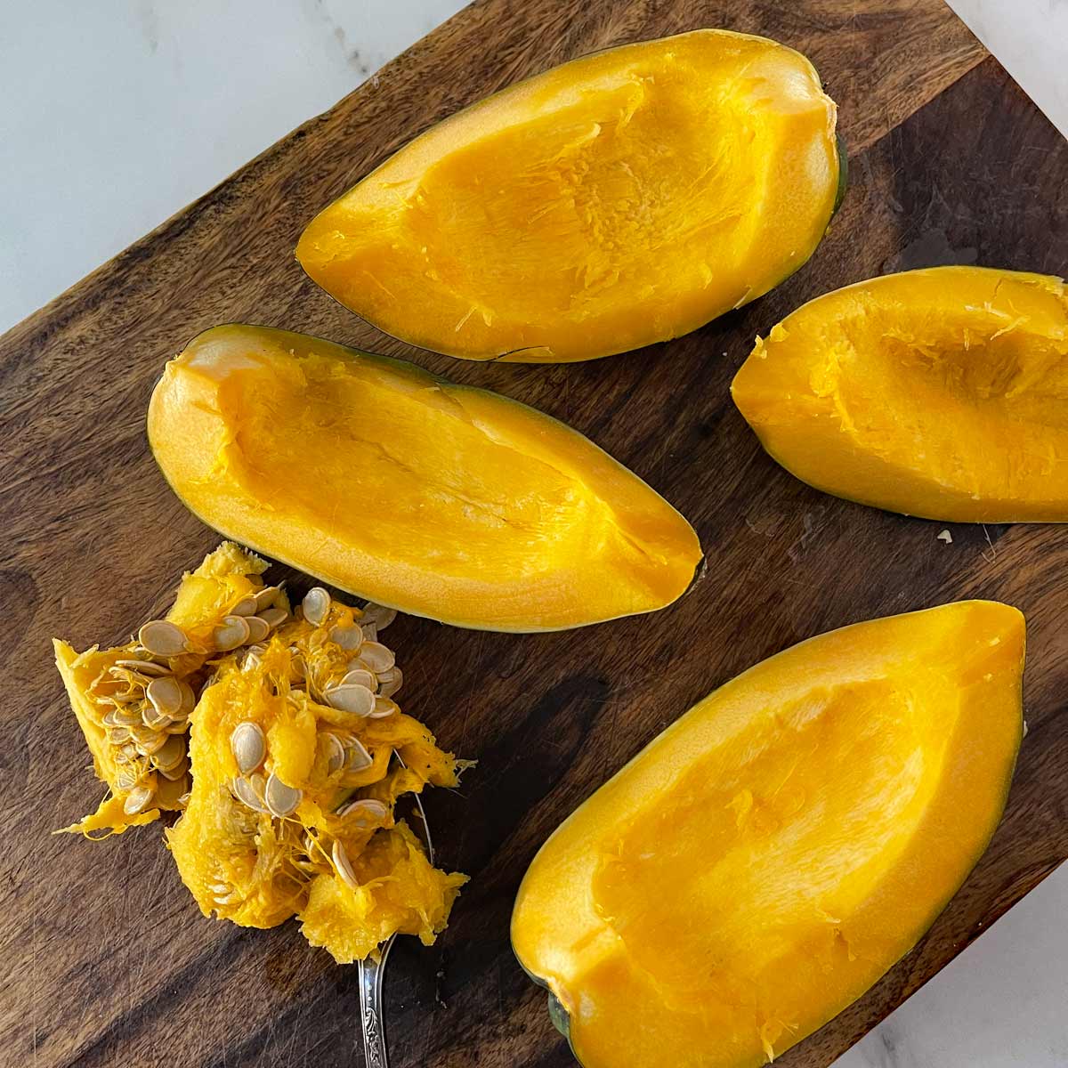 Acorn squash wedges with seeds and strings removed.