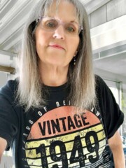 A woman wearing a vintage 1949 t - shirt.