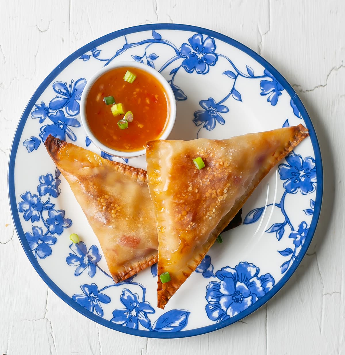 Sweet and Spicy Polynesian Pizza Pockets on plates.