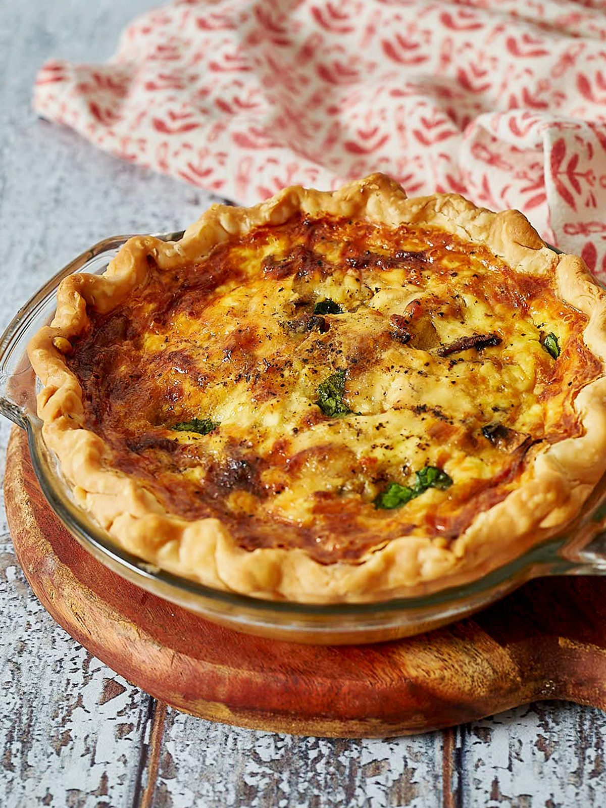 Baked quiche with golden crust and top.