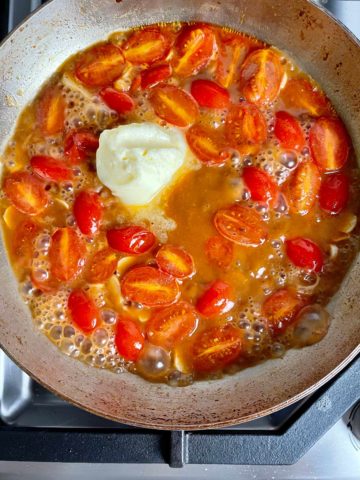 Butter added to the skillet with the tomatoes.
