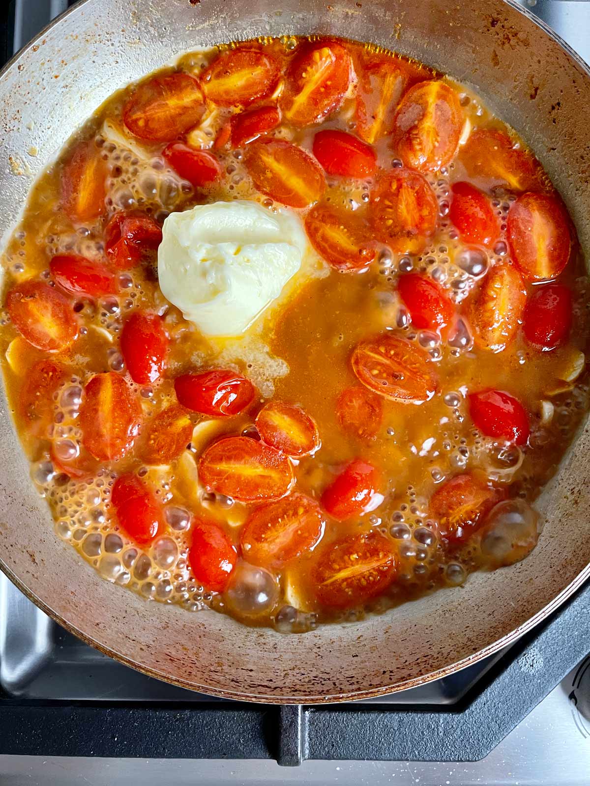 Butter added to the skillet with the tomatoes.
