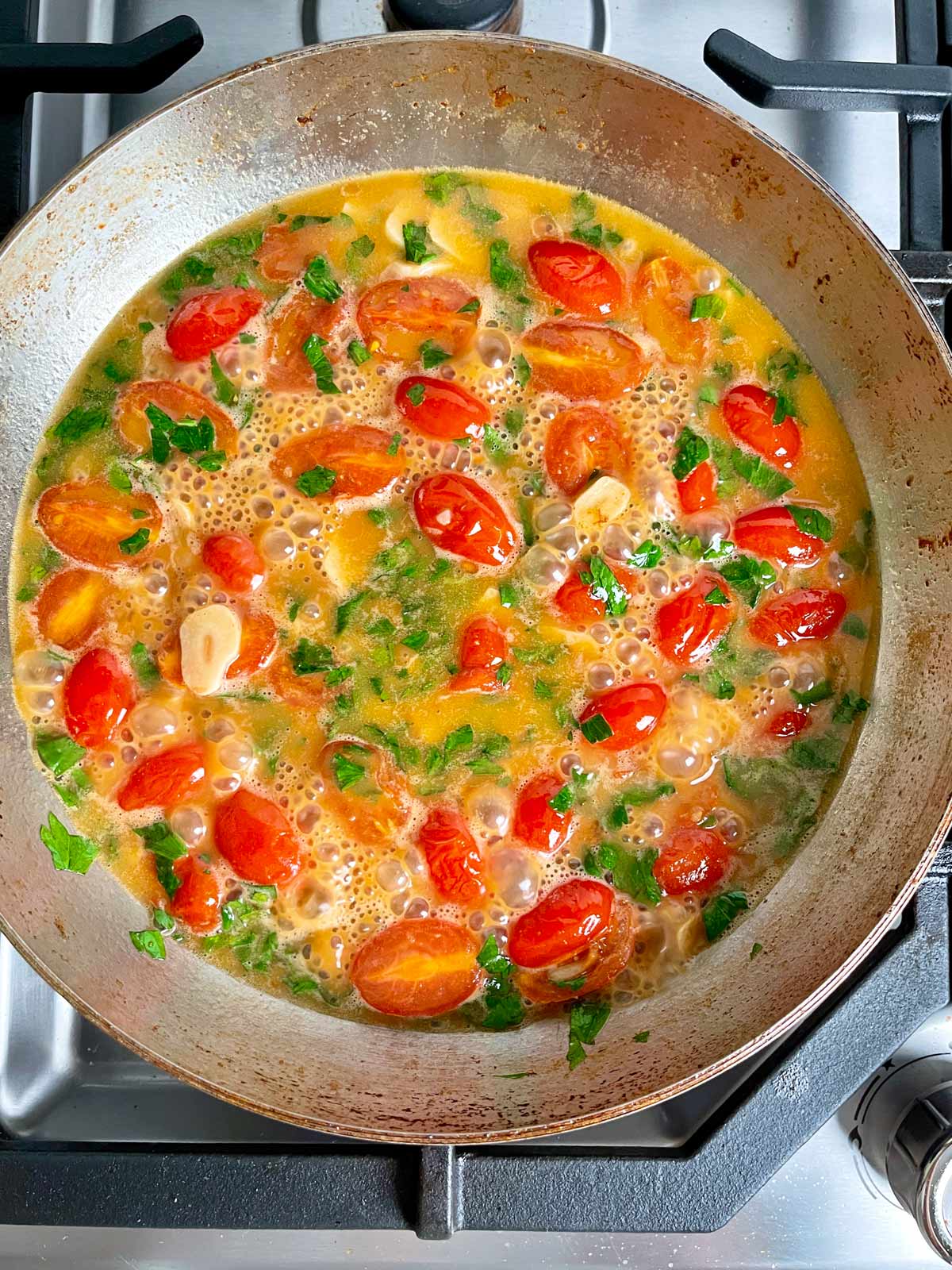 Cherry tomato sauce simmering.