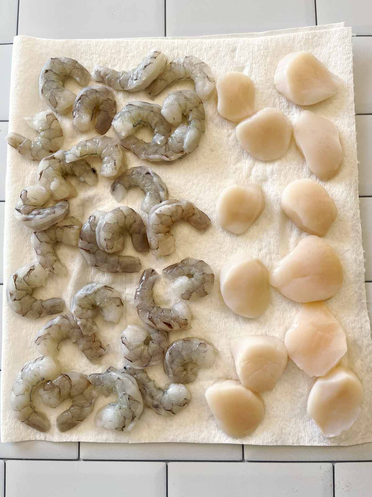 Shrimp and scallops on paper toweling.