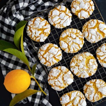 Cooling rack with crinkle top lemon cookies.