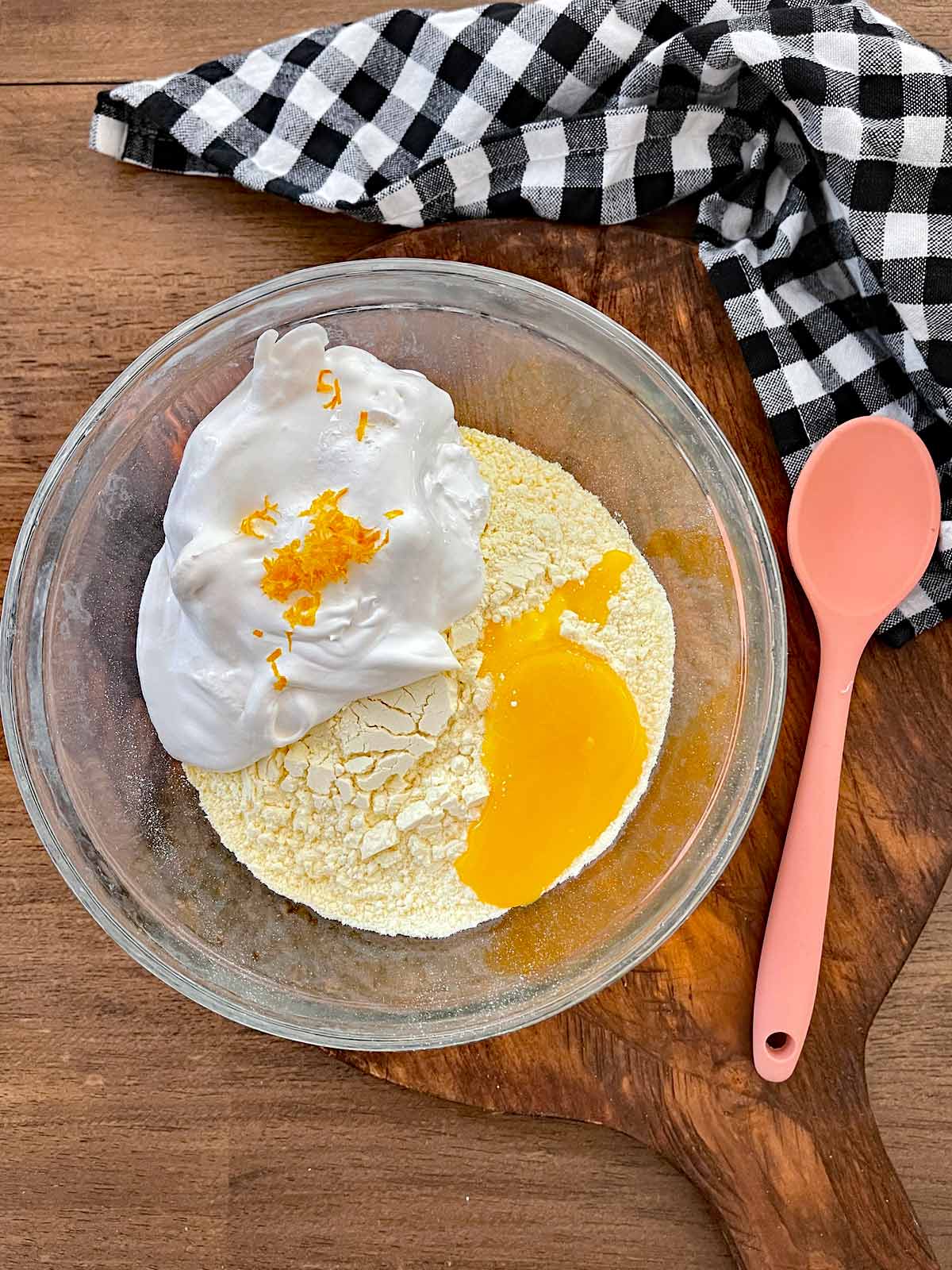 Mixing bowl with cake mix, egg yolks, cool whip and lemon zest.