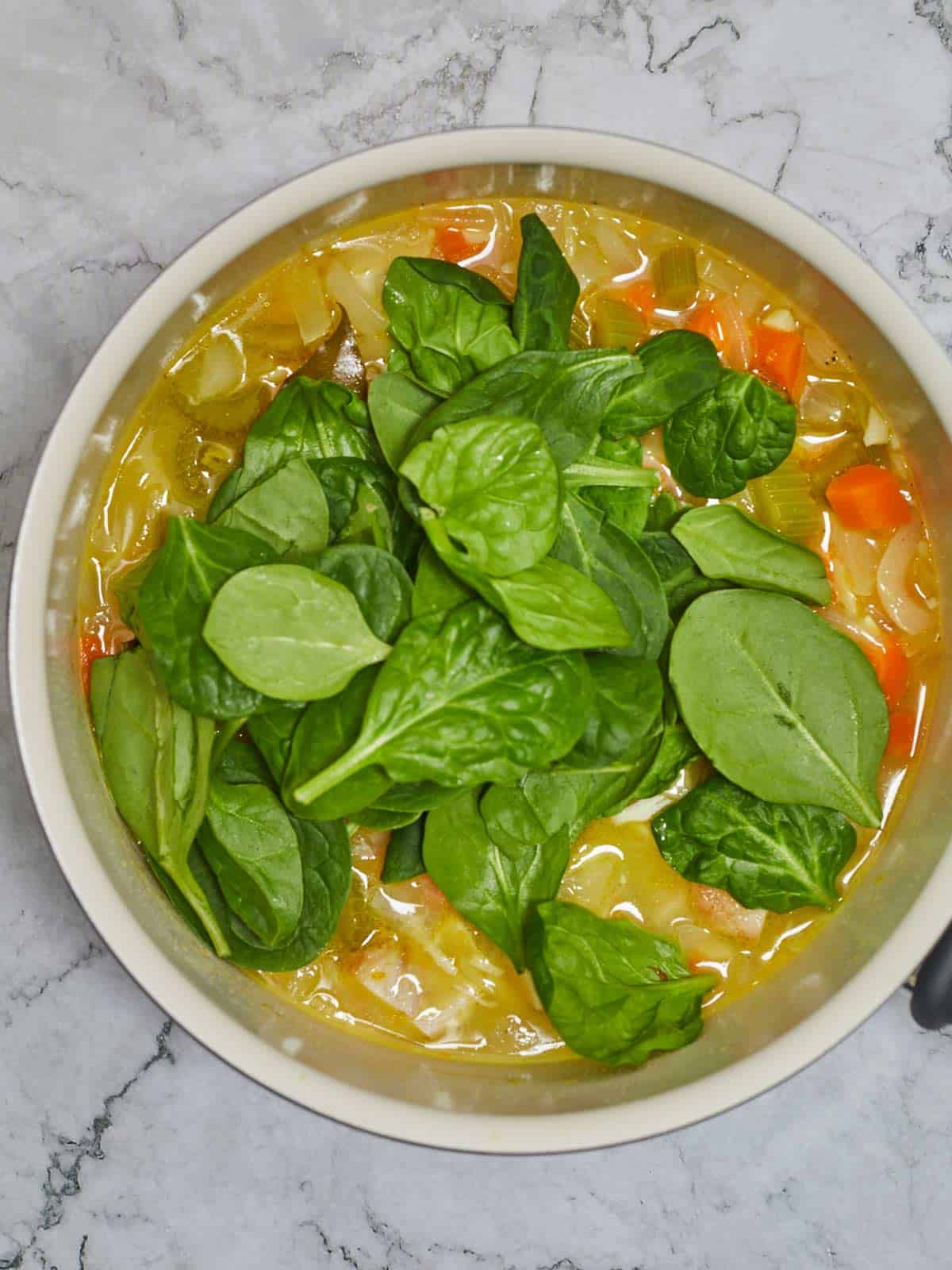 Fresh ababy spinach added to the soup.