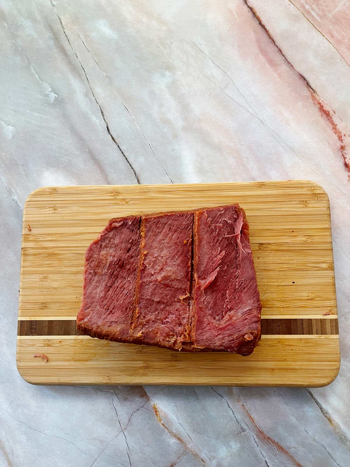 Scored piece of corned beef.
