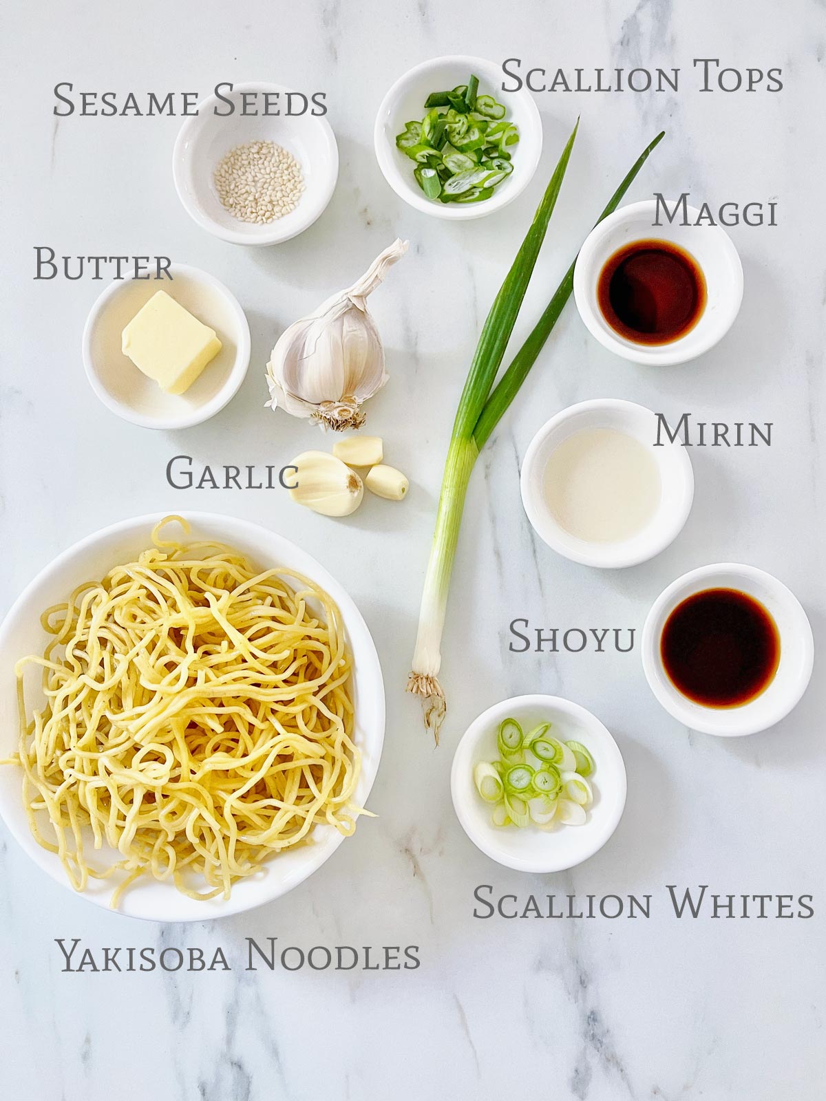 Ingredients for Garlic Noodles on a marble counter.