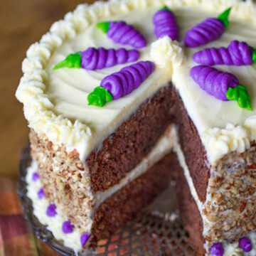 Cake with purple carrot decorations.