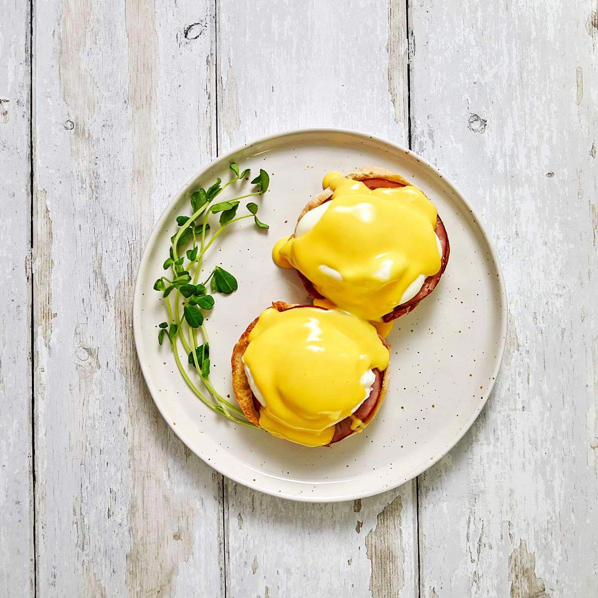 Eggs Benedict with Hollandaise sauce on top.