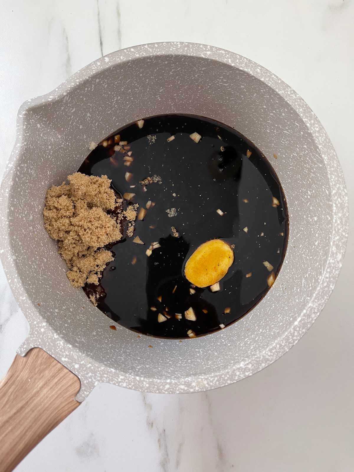 Soy sauce added to the pot.