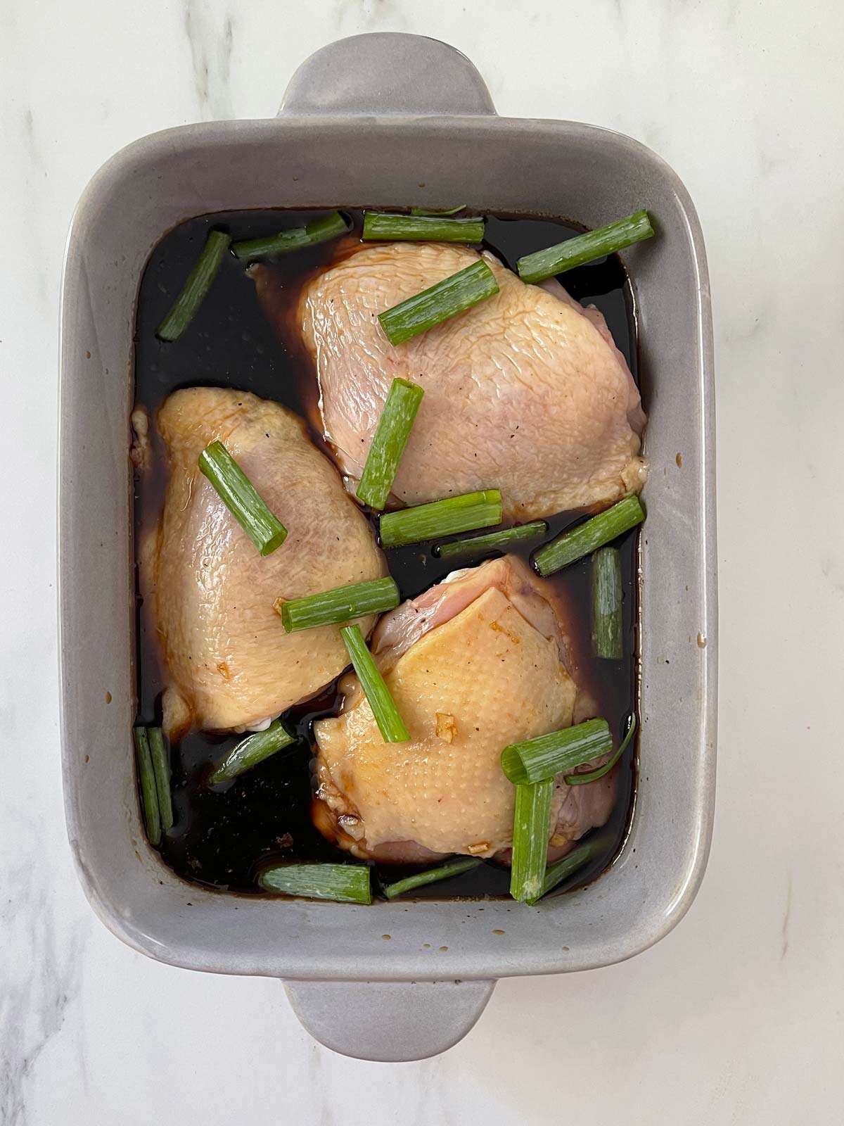 1 inch pieces of green onion tossed in the baking dish with the chicken.