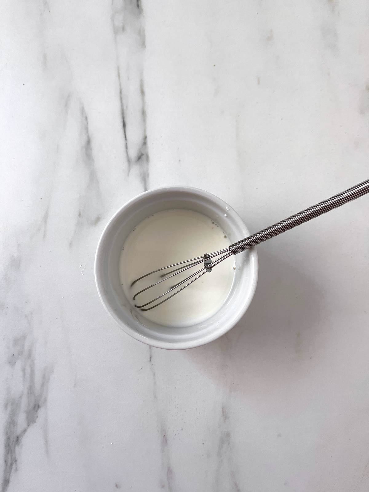 Cornstarch mixture with a small whisk.