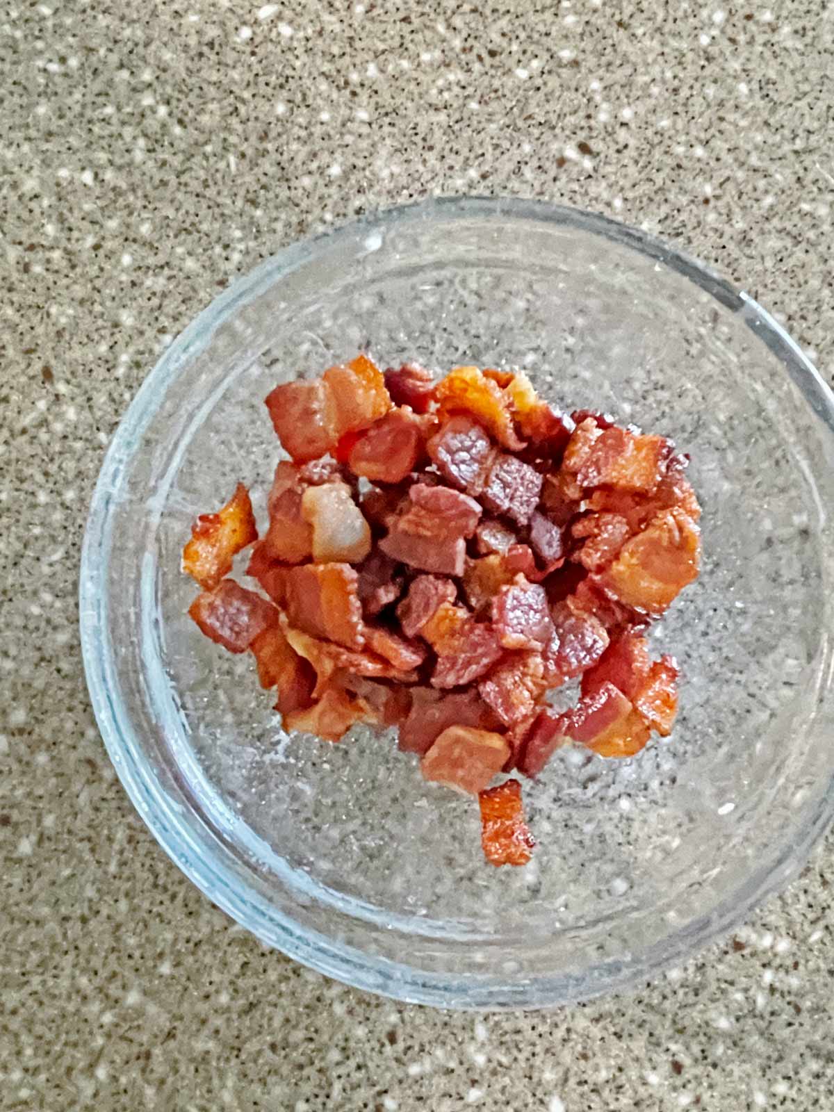 Cooked bacon removed from pot and placed into a small bowl.