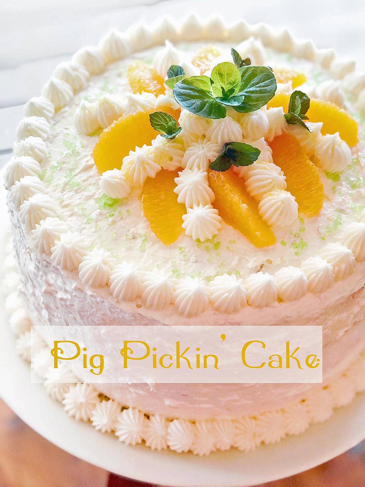 Layer cake with buttercream frosting and mandarin oranges.