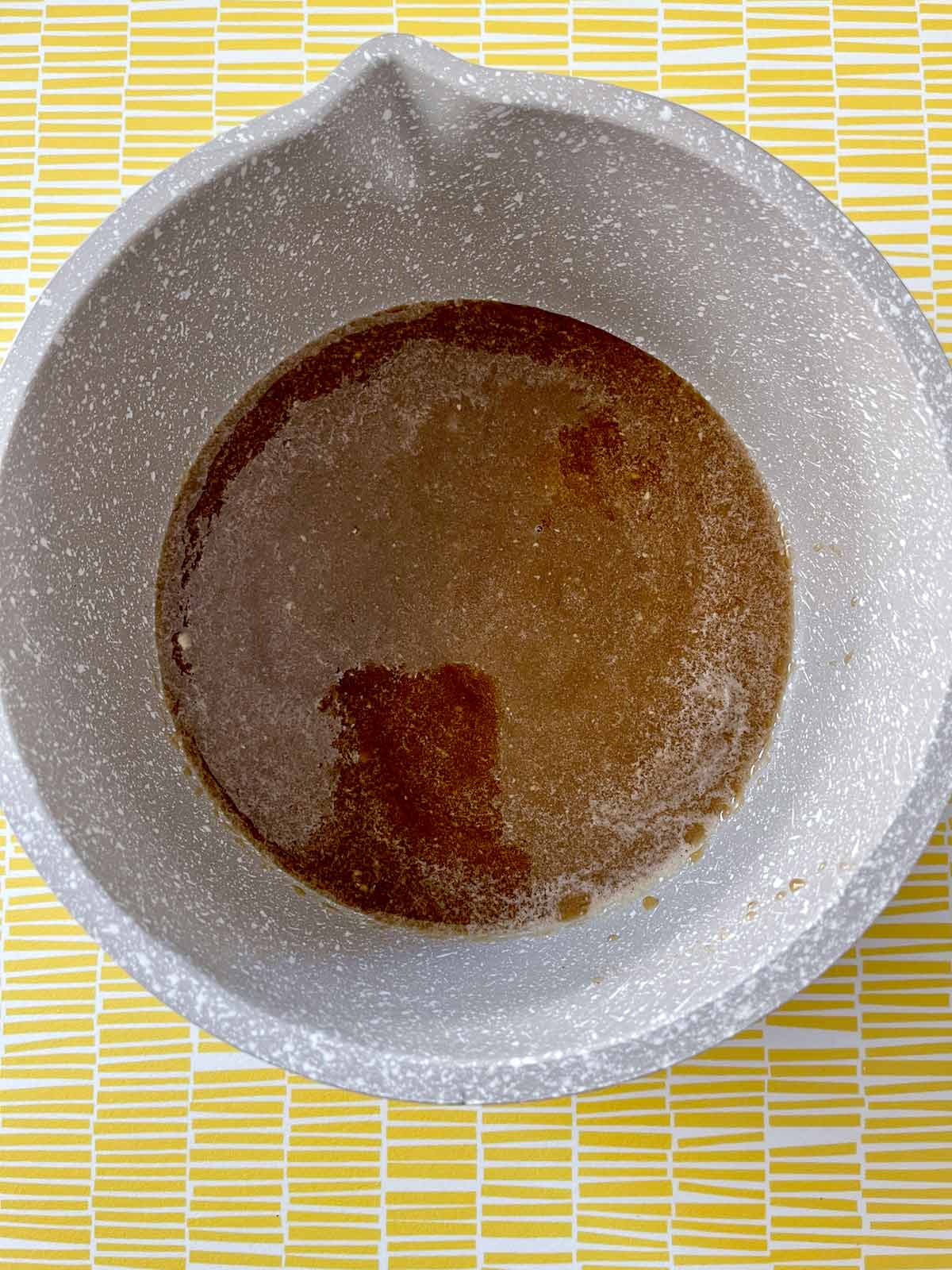 Picture of the puree from the food processor poured into a small saucepan.