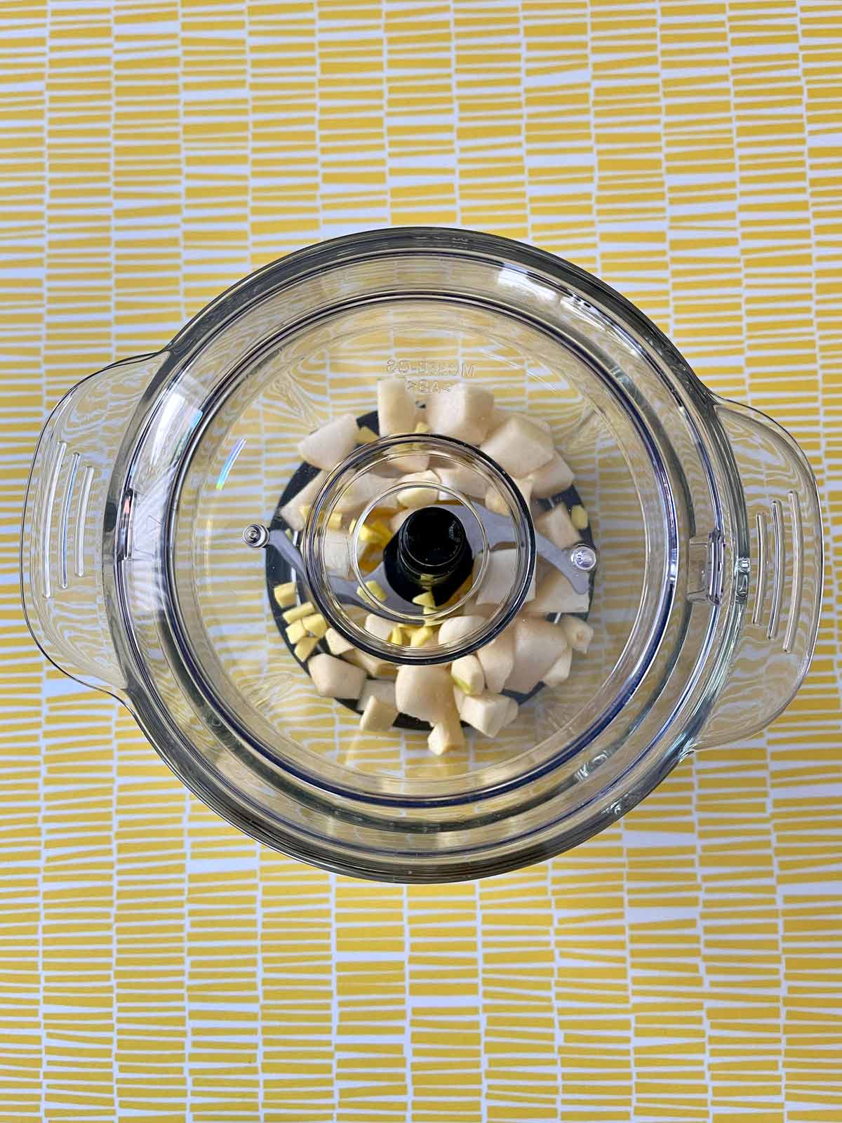 Chopped ginger, garlic, and pear in the food processor.