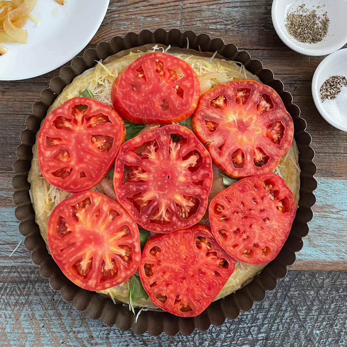 Tart with tomato slices on top.