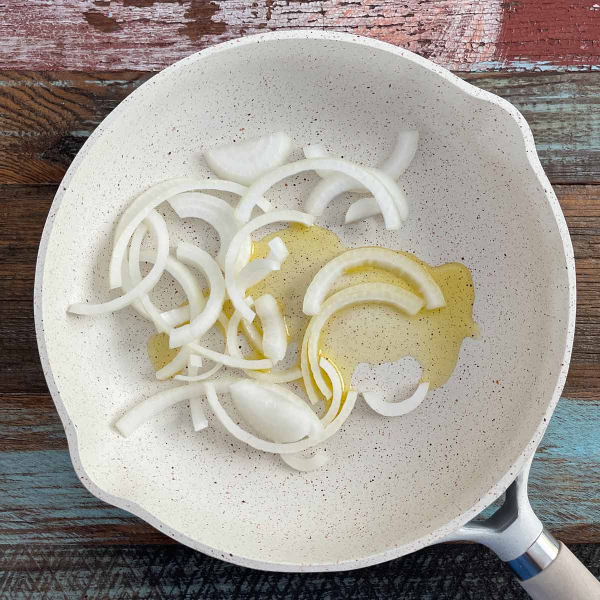 Saute pan with olive oil and sliced onion.