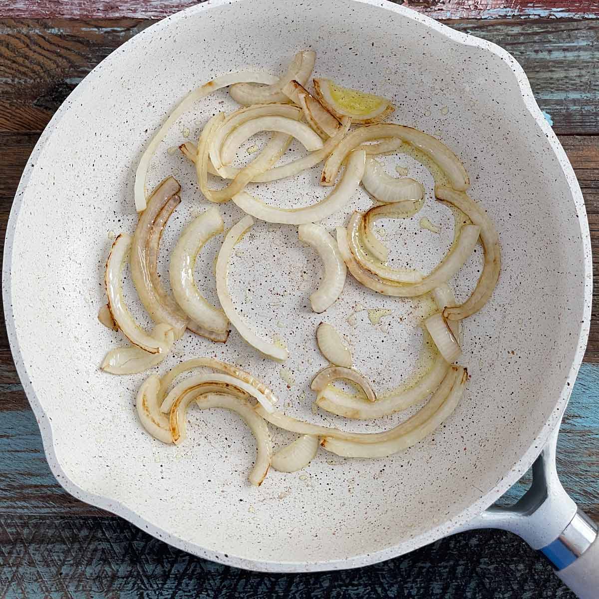 Saute pan with lightly browned onions.