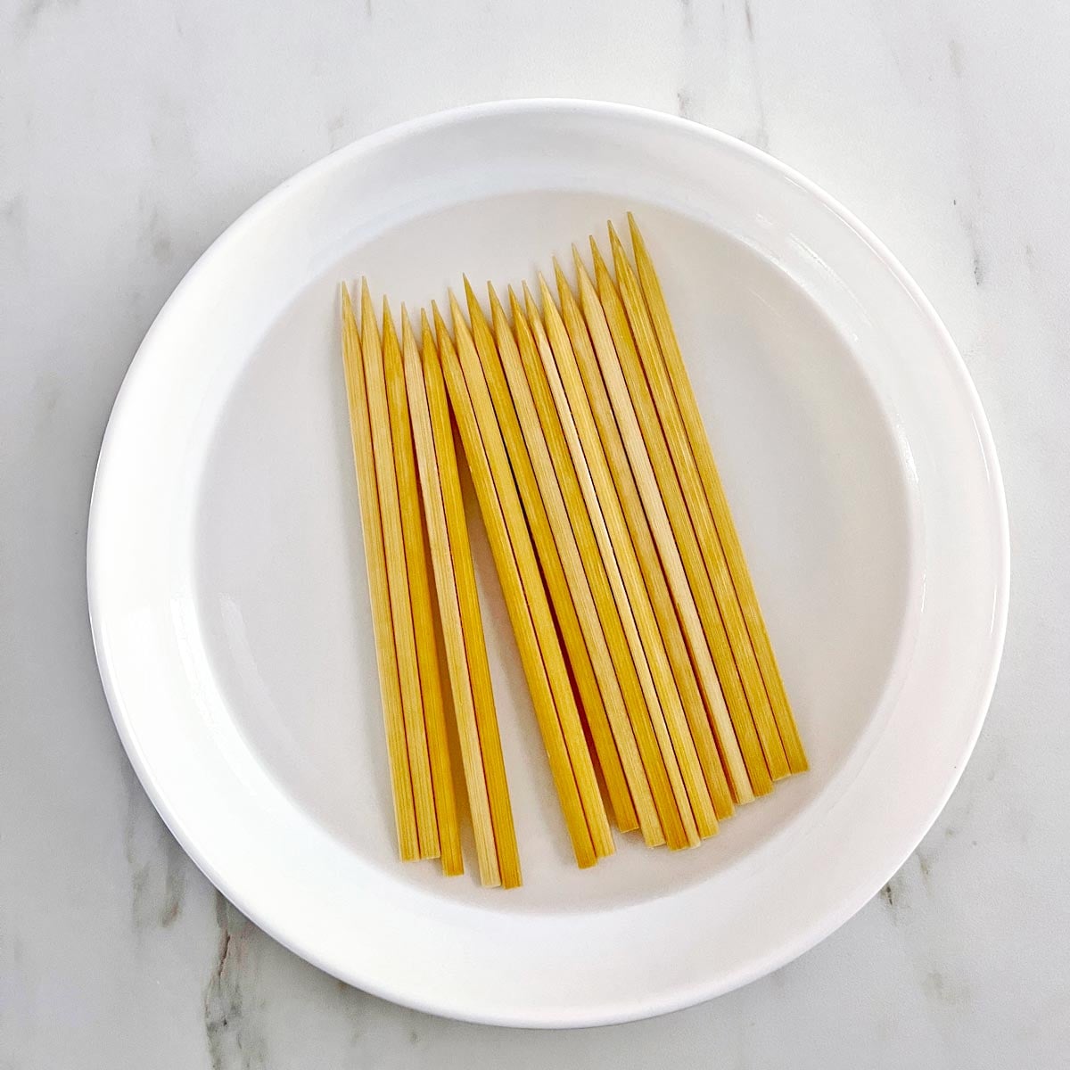 Wooden skewers soaking in water.