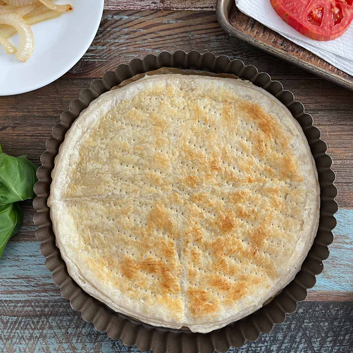 Lightly golden brown partially baked puff pastry.