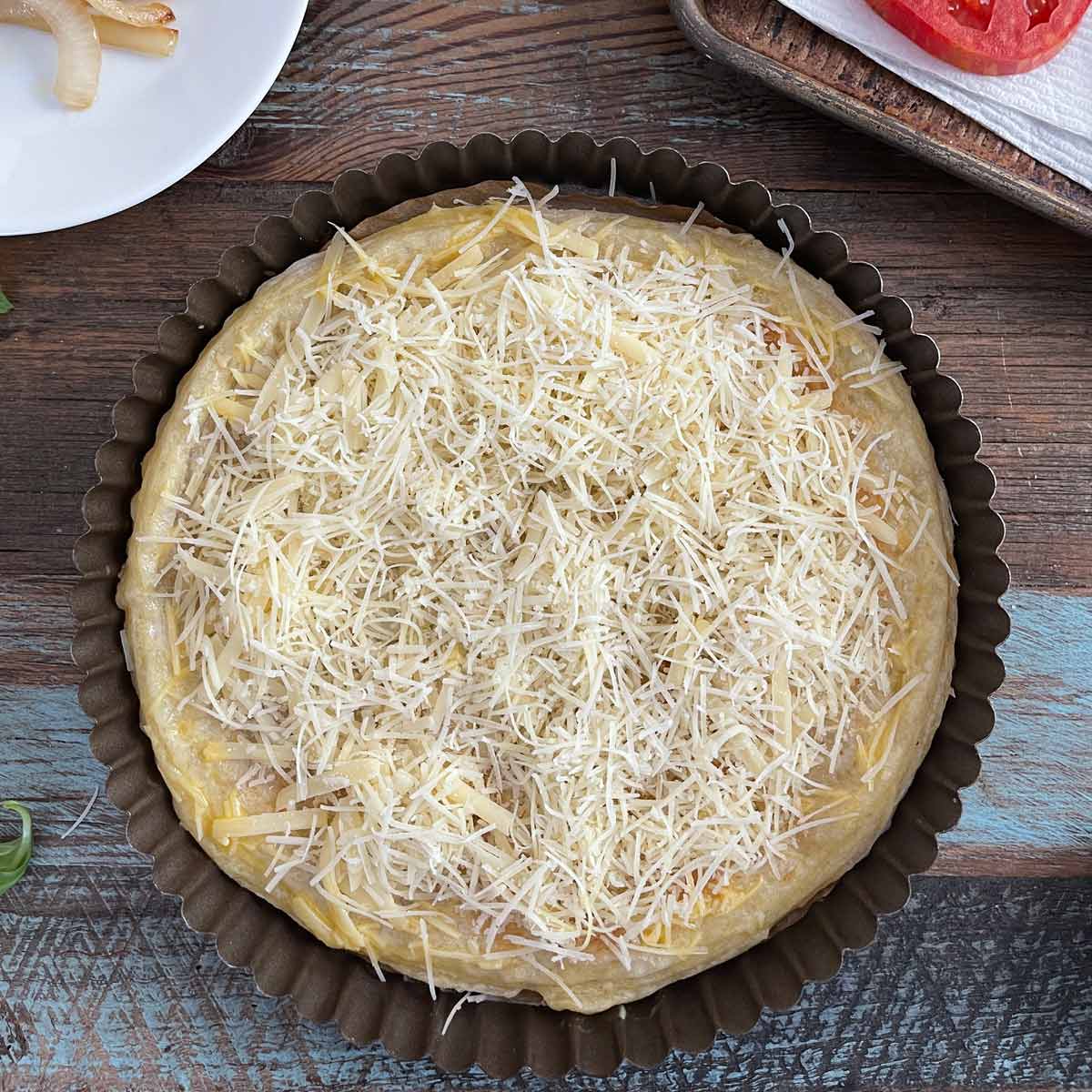 Puff pastry with grated cheese.