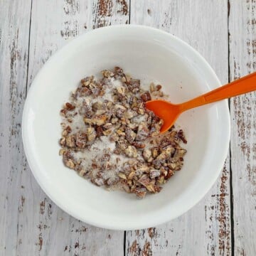 Bowl with mixed sugar, cinnamon, and chopped pecans.