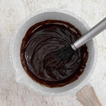 Saucepan with melted chocolate ganache.