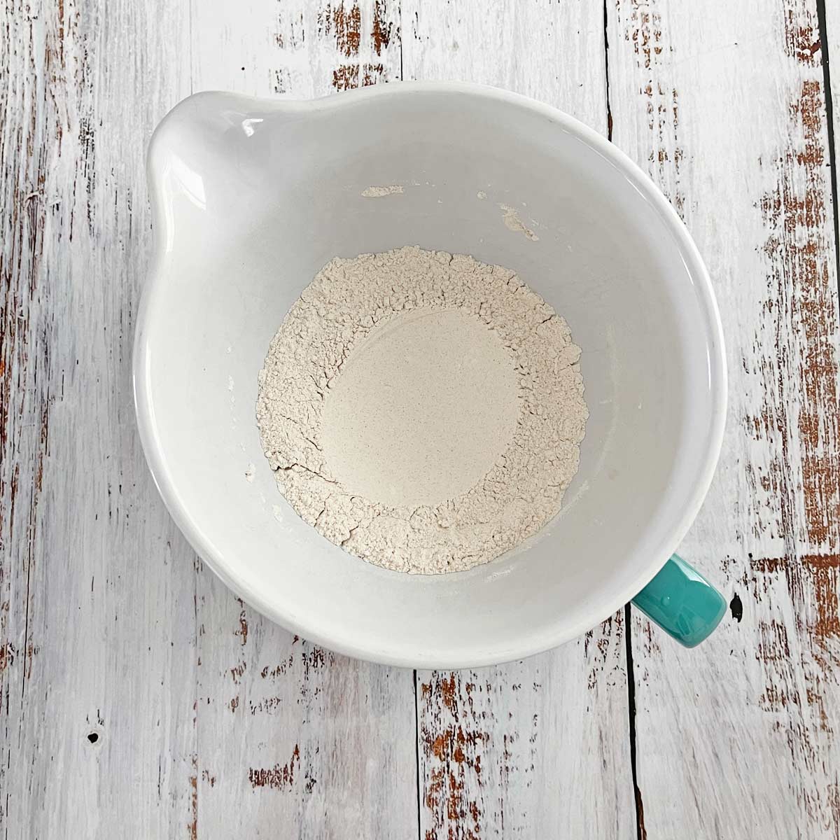 Dry ingredients mixed with a well made in the center.