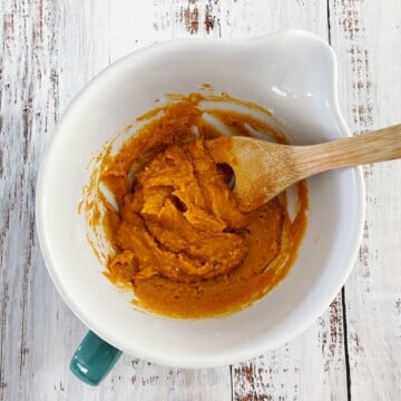 Mixing wet and dry ingredients in mixing bowl.