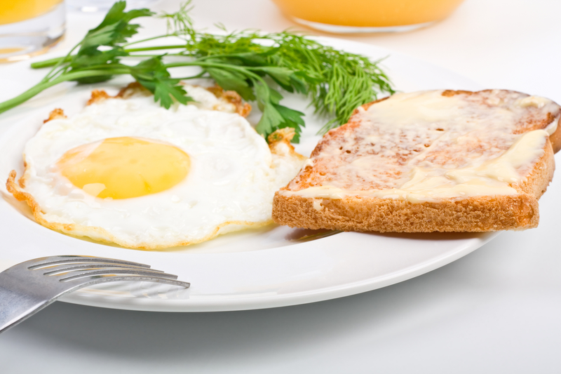A plate of fried egg and toast.