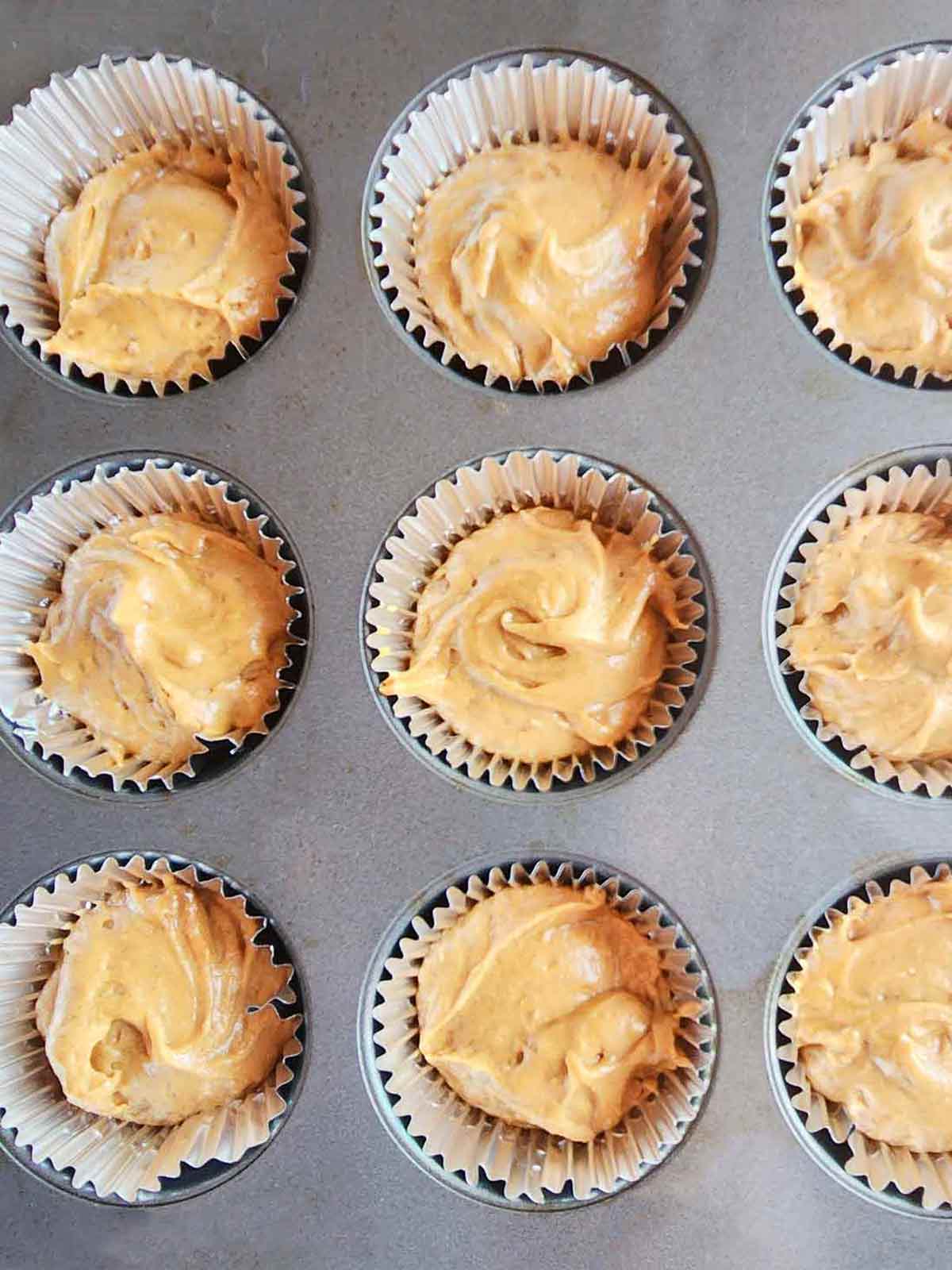 Cupcake liners filled in the cupcake pan.