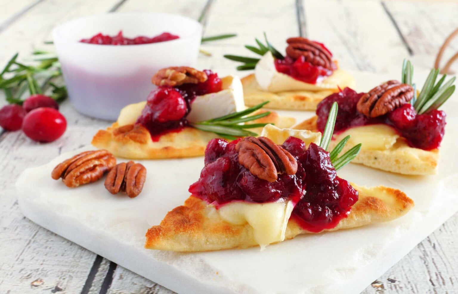 Appetizer with puff pastry, brie and cranberries.