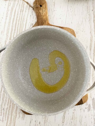 Dutch oven with olive oil swirl.