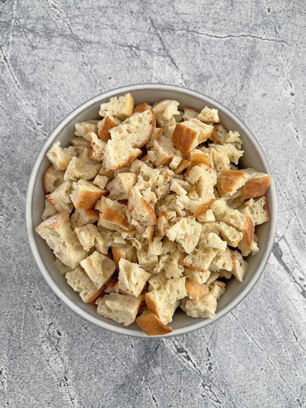 Bowl with dried bread cubes.