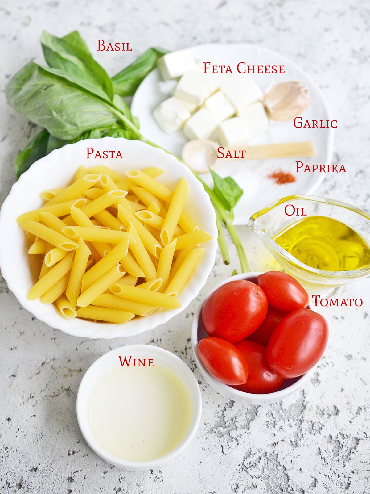 All of the ingredients to make TikTok Feta Pasta with Cherry Tomatoes.