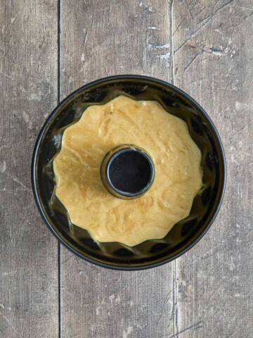 Bundt cake pan with the batter poured in.