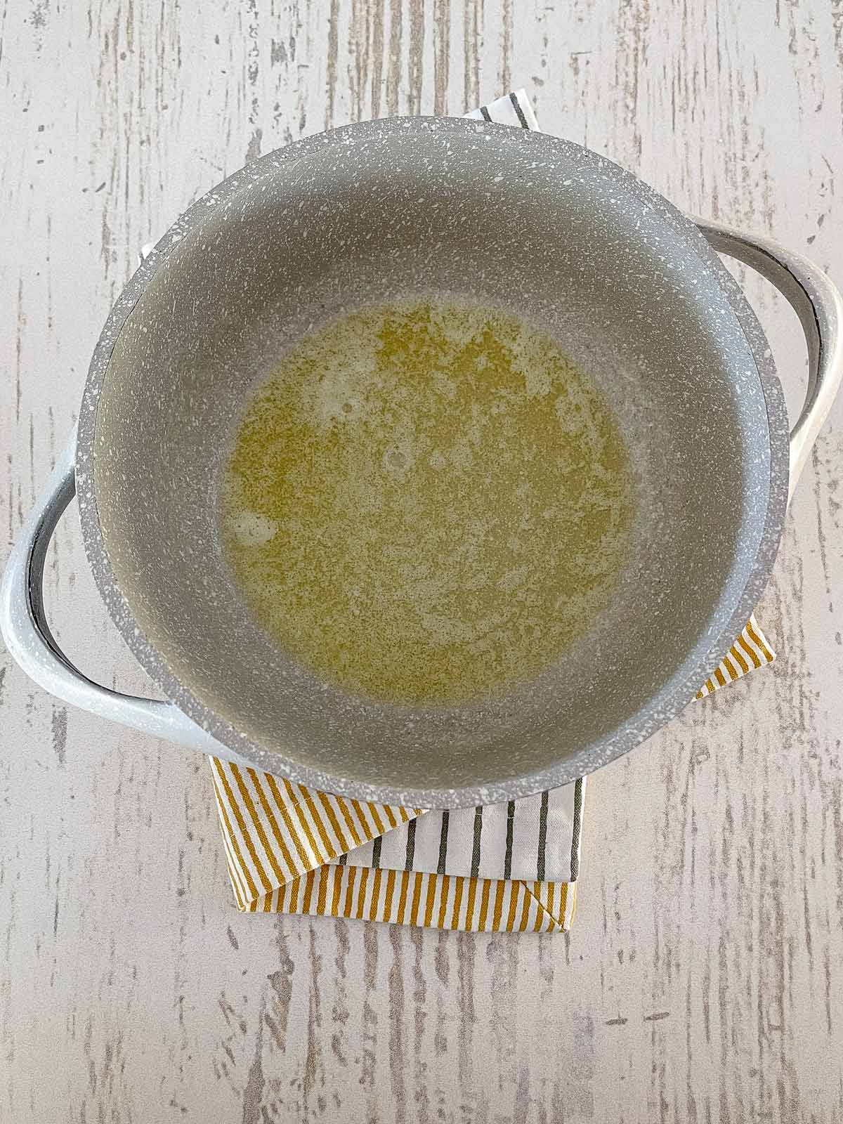 Pot with melted butter bubbling.