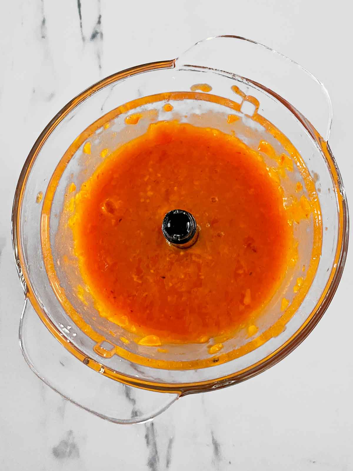 Persimmon pulp after being pureed in the food processor.