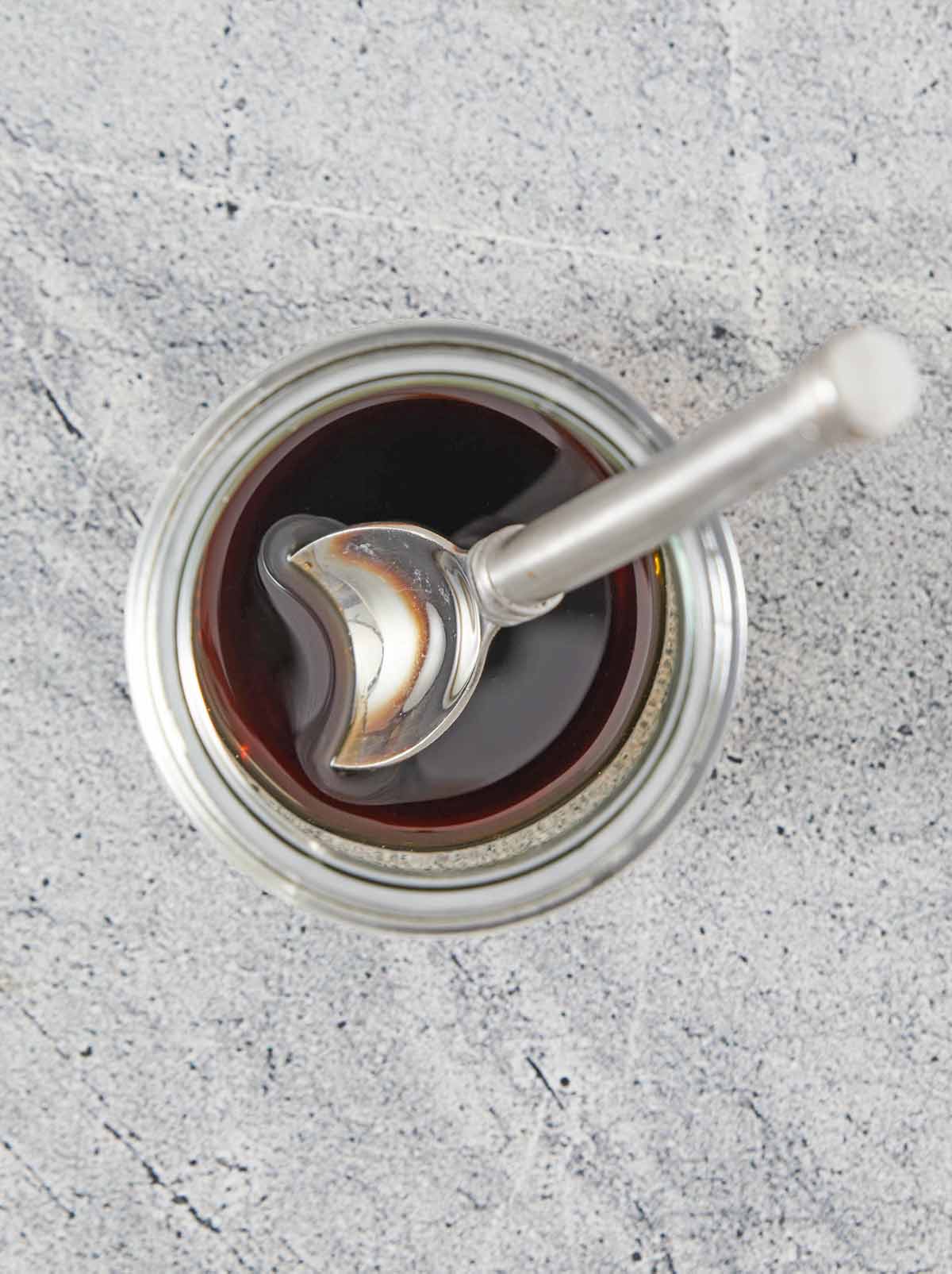 Jar of dressing with spoon.