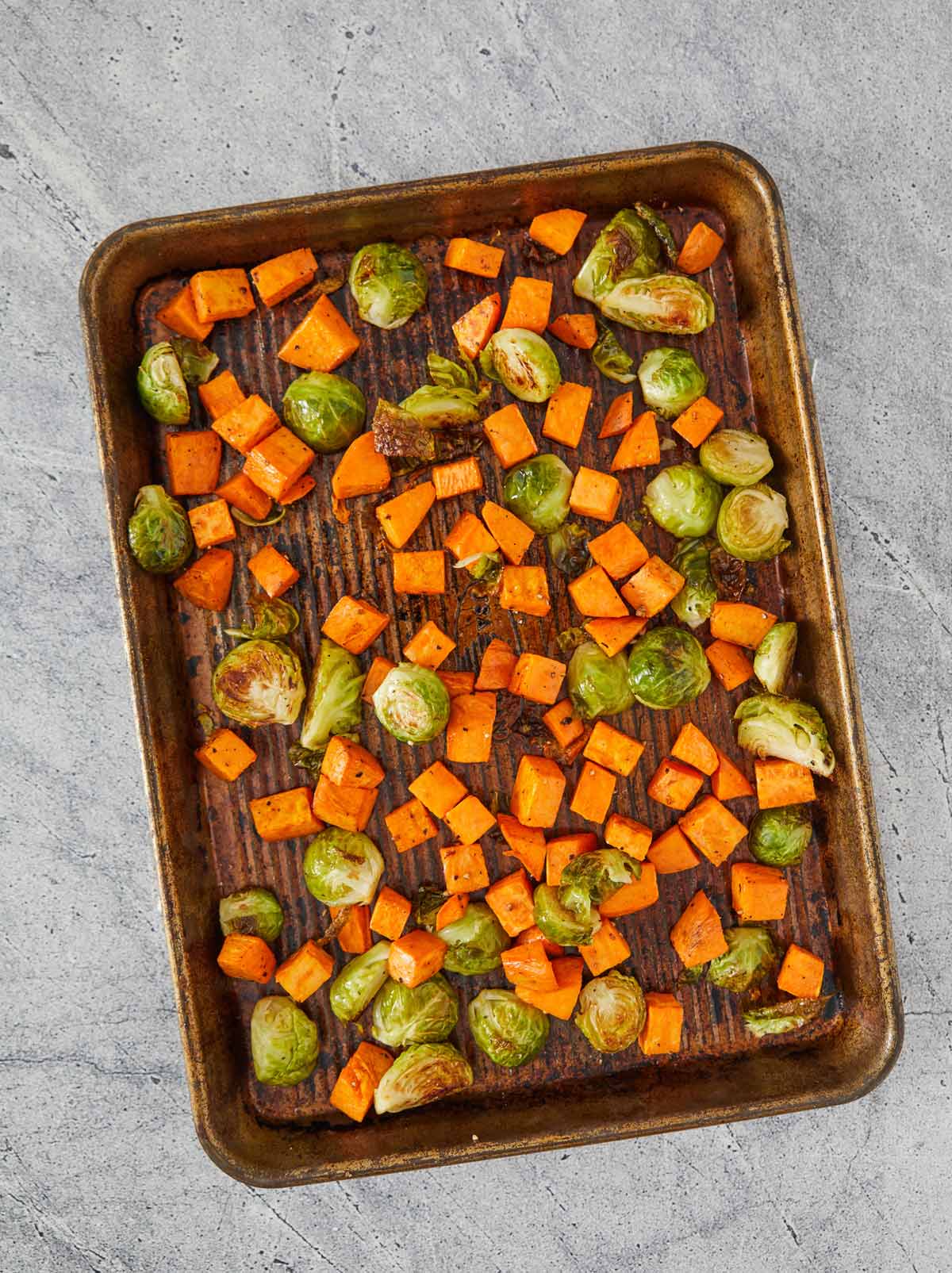 Sheet pan with roasted vegetables.