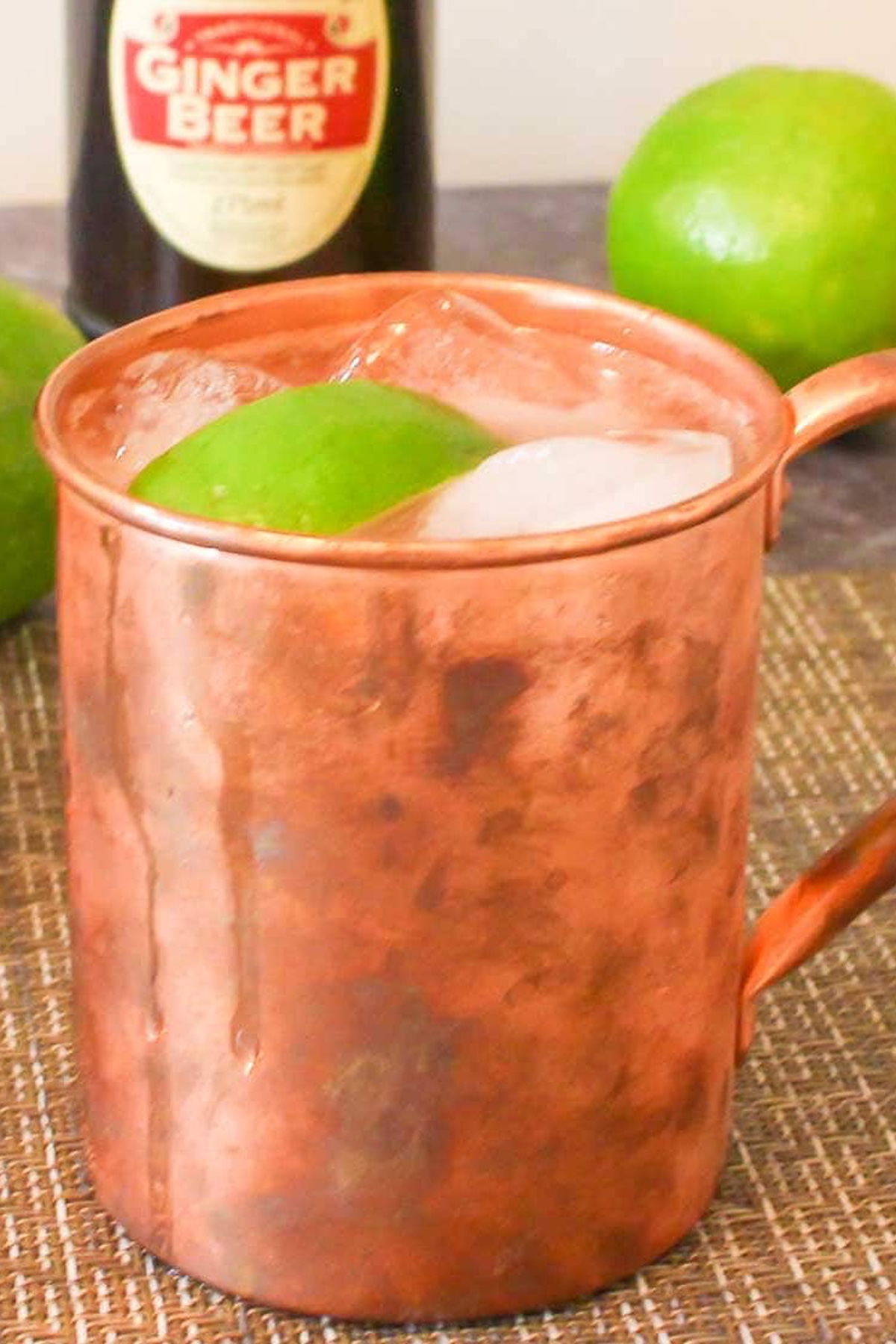 Copper cup with a Moscow Mule with bitters.