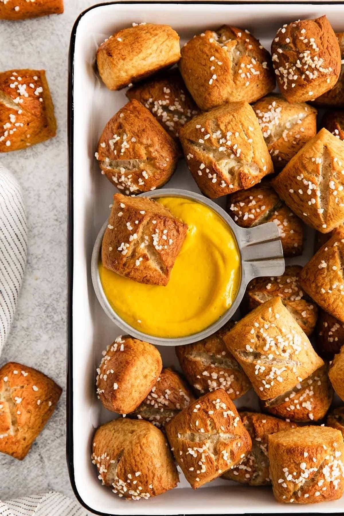 Mini pretzel bites with cheese dip.