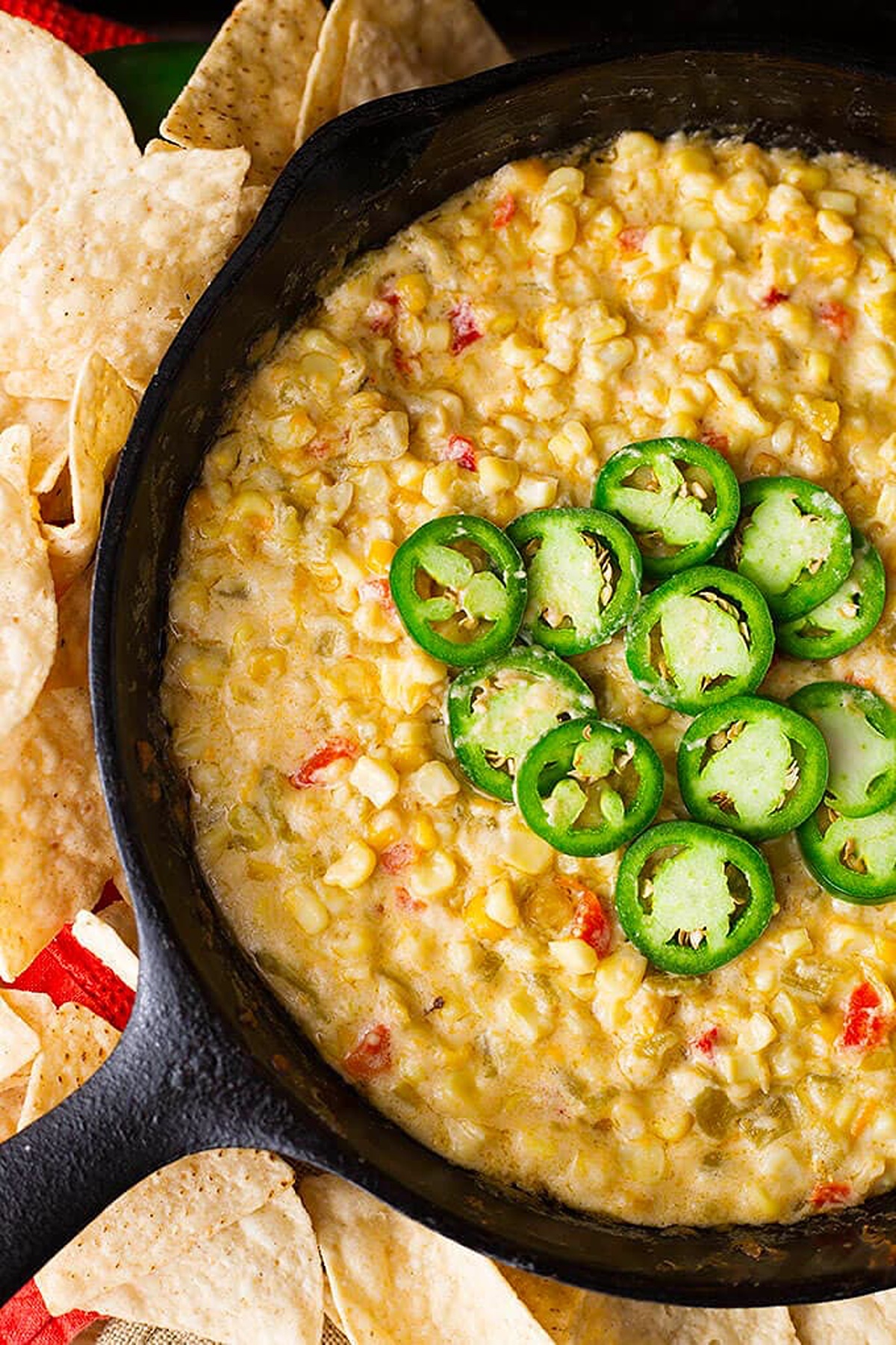 Party appetizer with corn, cheese, and fresh sliced jalapenos.