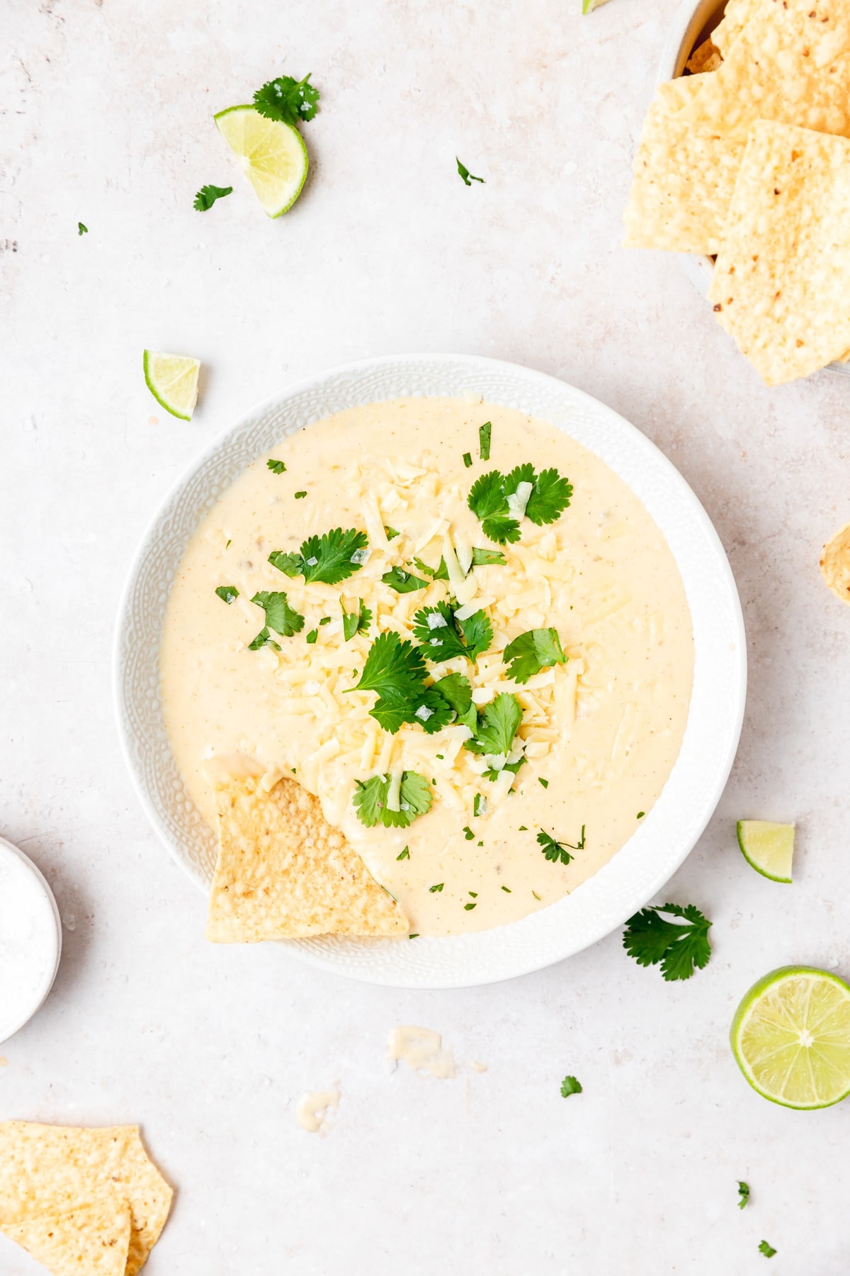 Cheese dip with triangular tortilla chips.