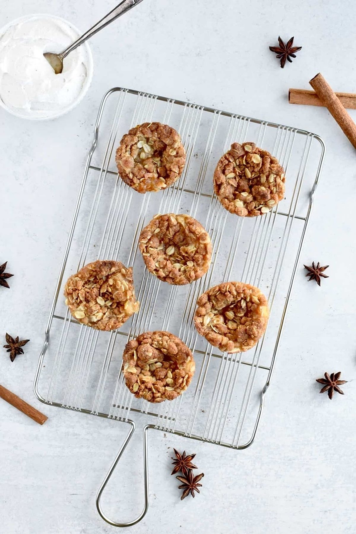 Petite mini apple tarts on cooling rack.