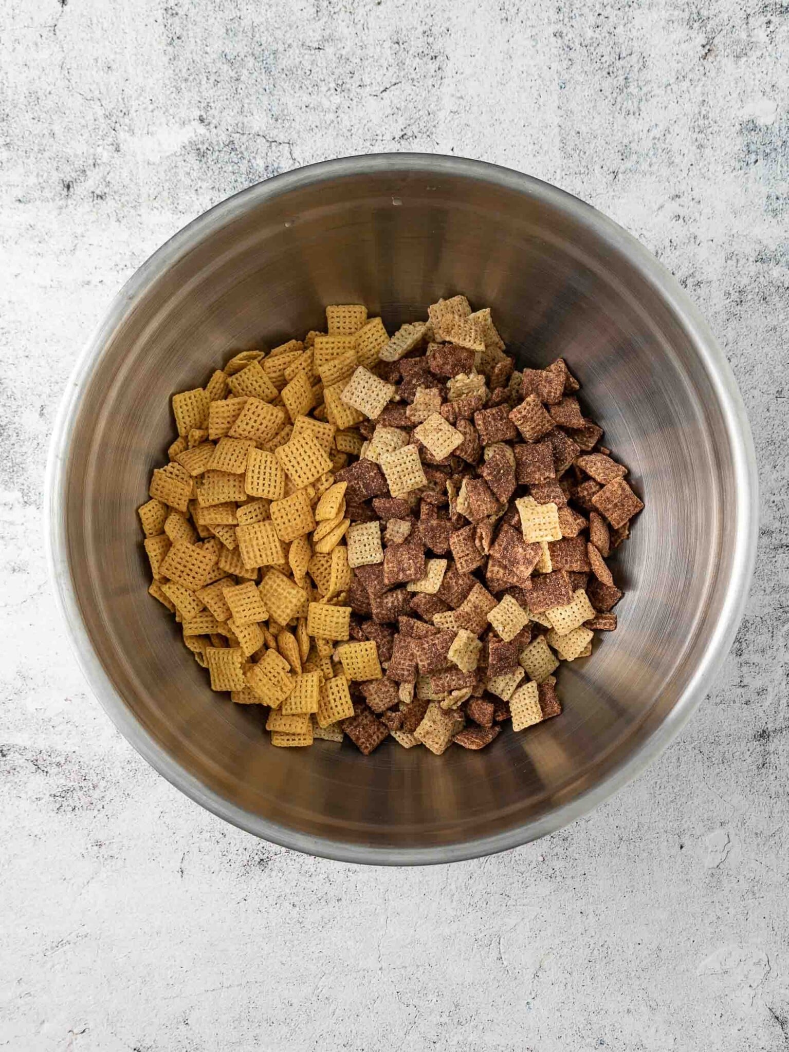 Mixing bowl with two kinds of Chex cereals.